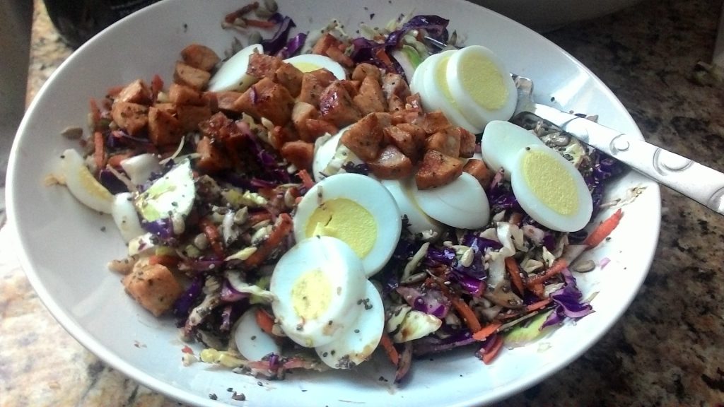 Eggs, sausage, and shredded cabbage.