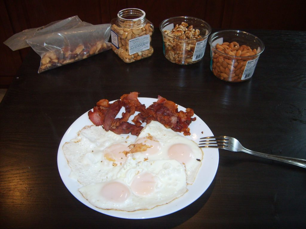 Eggs, bacon, and assorted nuts. High protein, mod fat, zero carb.